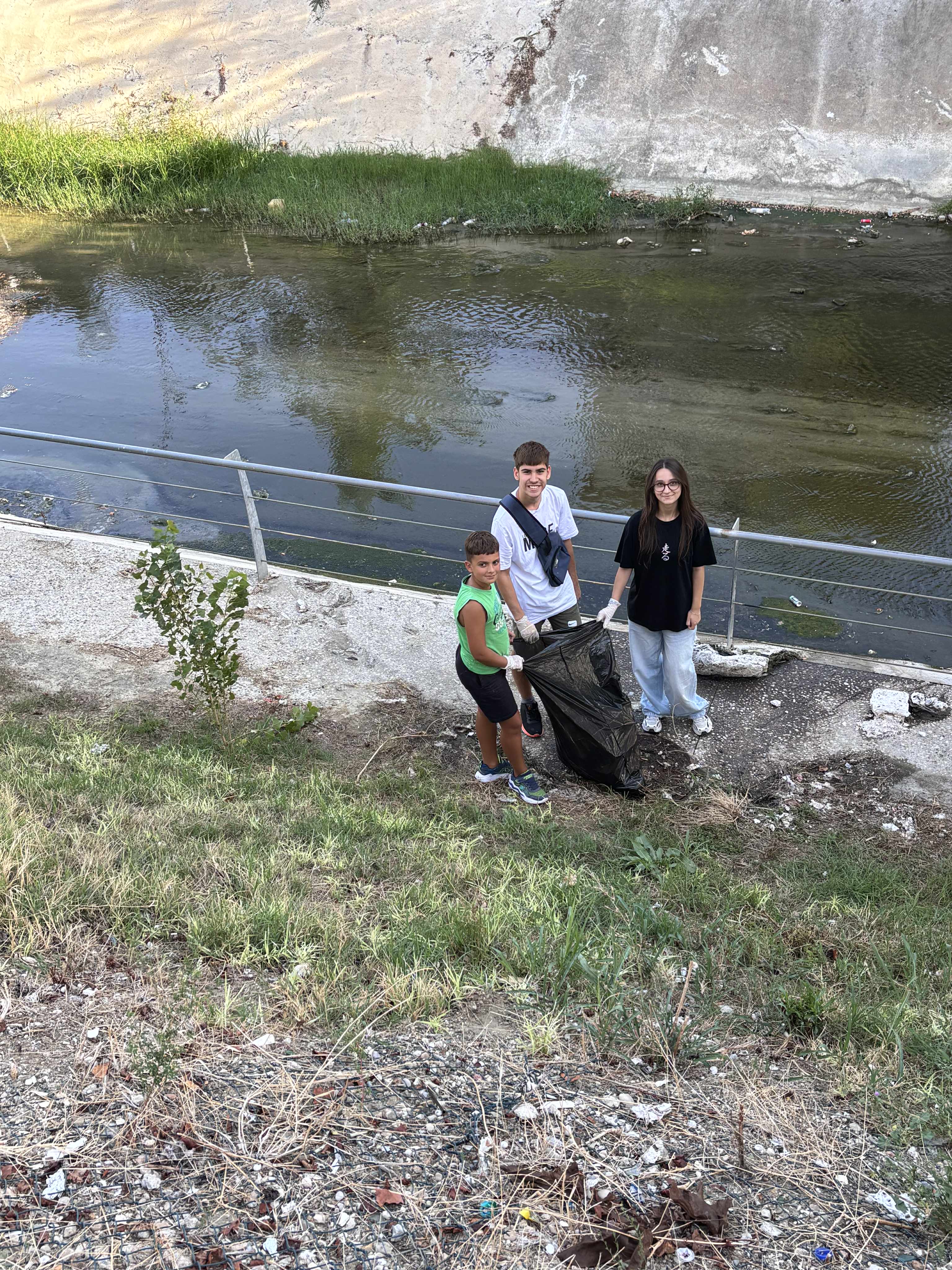 Kids with gloves after cleanup